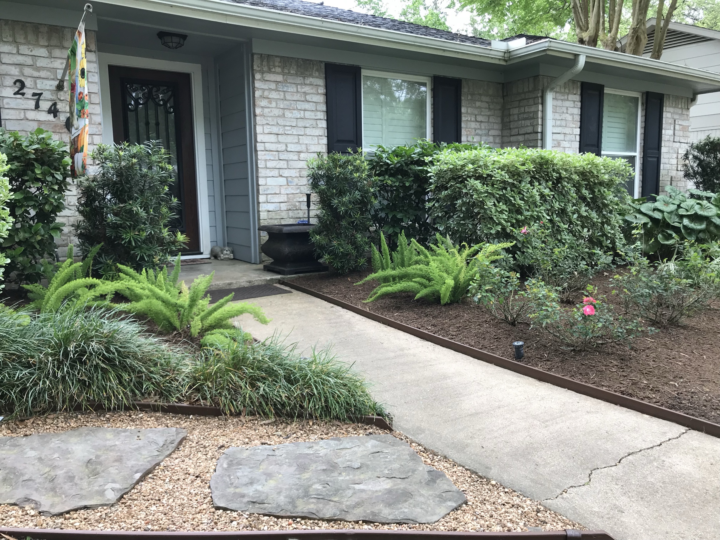 Landscaping company in El Lago — finished daytime landscape with stone walk and lawn