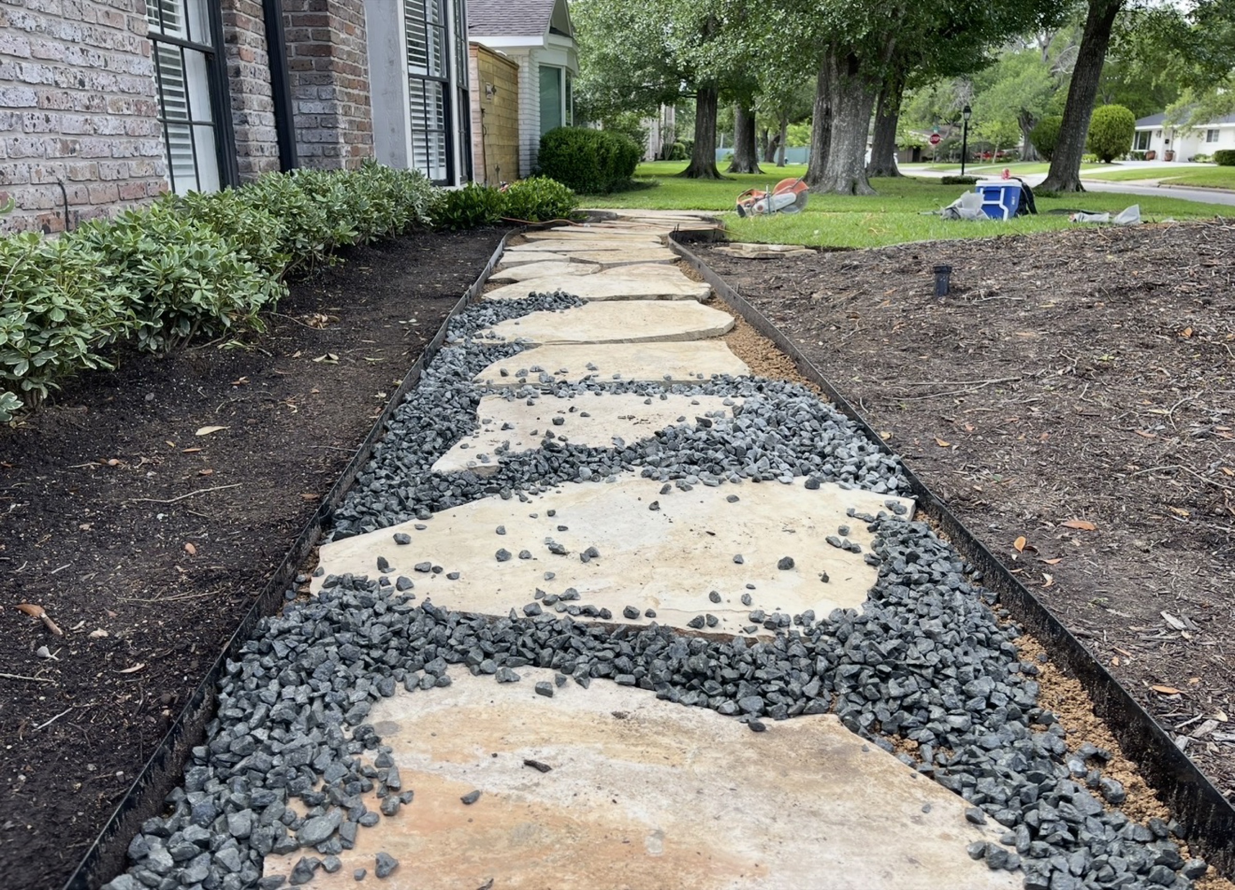 Flagstone stepping walk along a Houston home