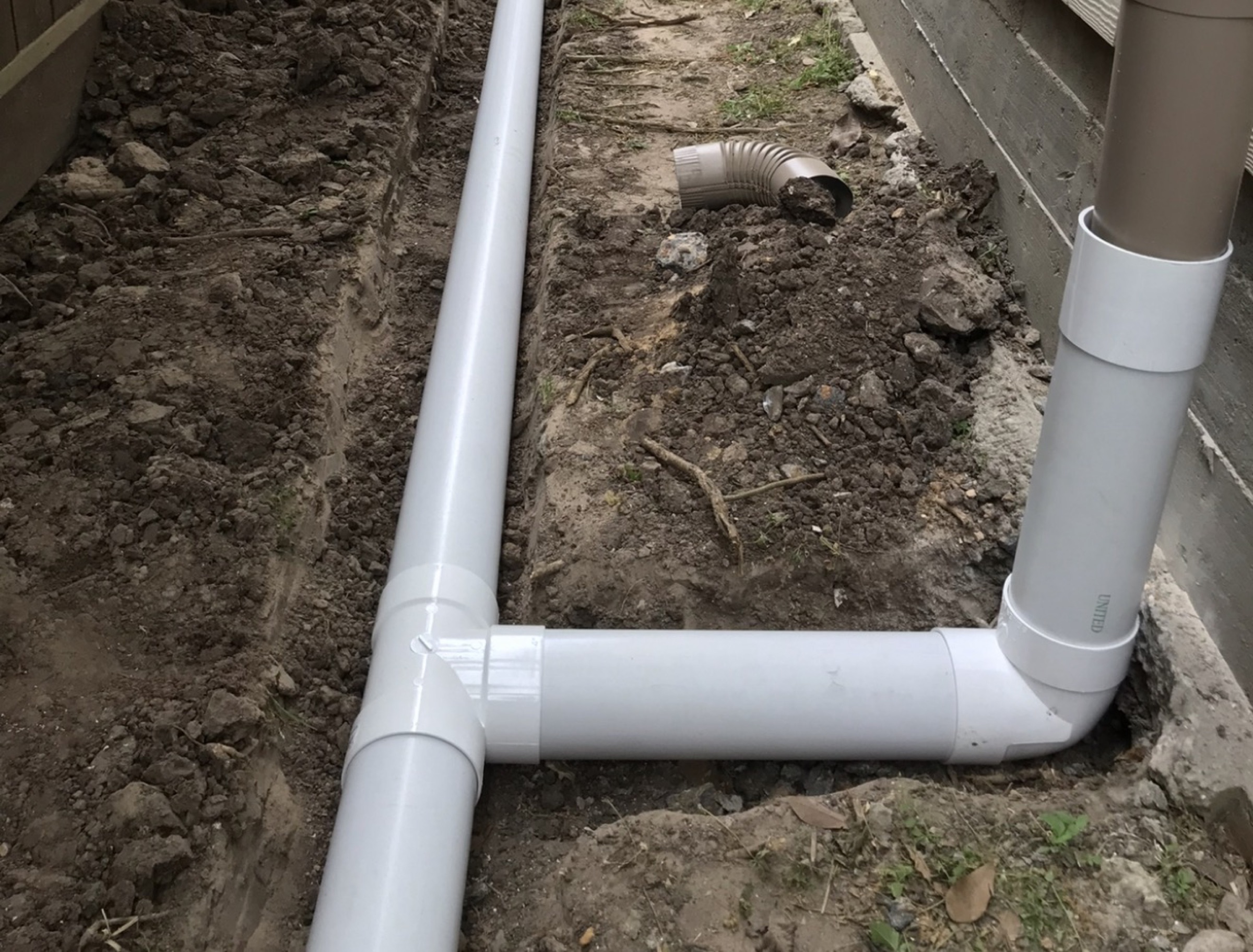 Connected drainage piping on a Houston lot